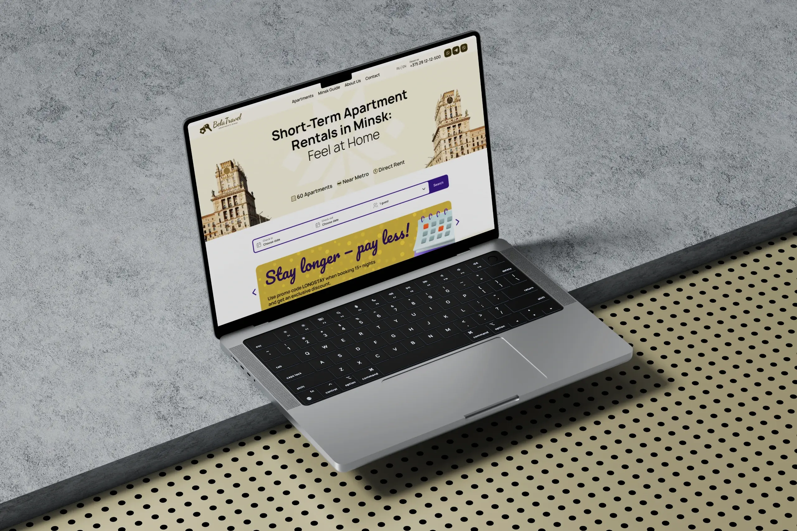 Apartment rental website hero section featured on a laptop display.